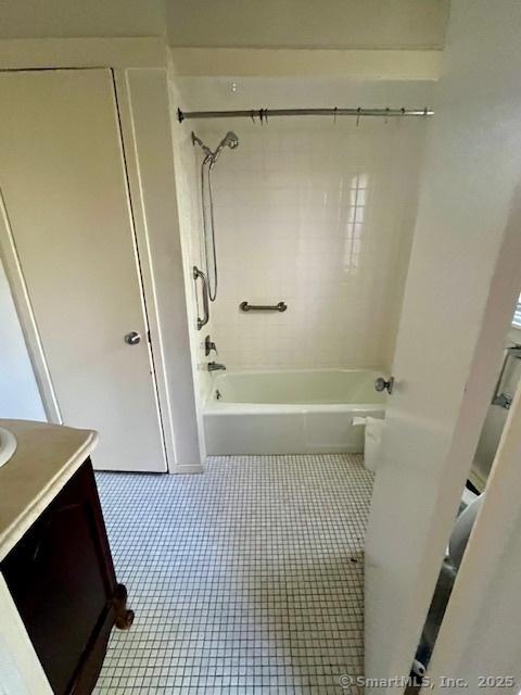 9 Heritage Cir Unit D, Southbury, CT 06488 - bathroom with vanity, washtub / shower combination, and tile patterned flooring