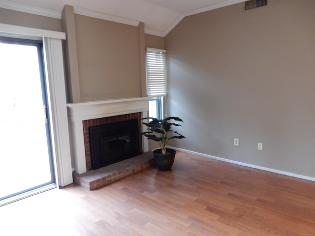9 Heritage Cir Unit D, Southbury, CT 06488 - living room with ornamental molding, wood finished floors, lofted ceiling, plenty of natural light, and baseboards