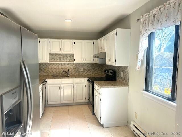 9 Heritage Cir Unit D, Southbury, CT 06488 - kitchen featuring stainless steel appliances, under cabinet range hood, healthy amount of natural light, and decorative backsplash