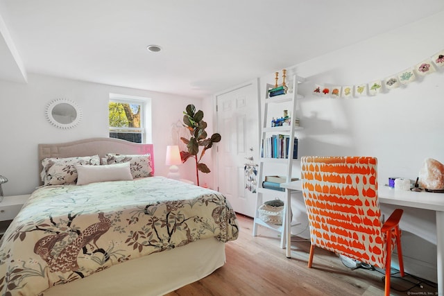 bedroom with wood finished floors