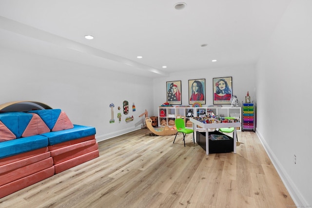 game room featuring recessed lighting, wood finished floors, and baseboards