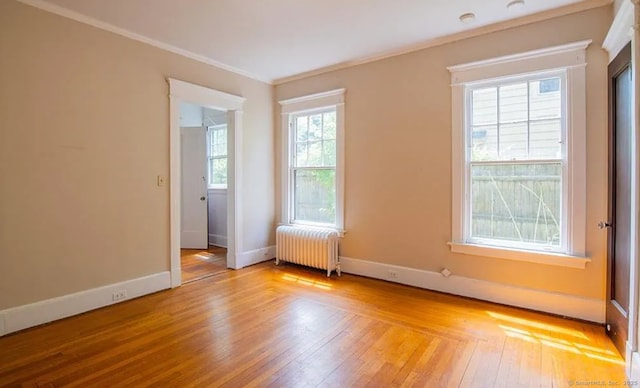 187 W Park Ave, New Haven, CT 06511 - spare room featuring ornamental molding, hardwood / wood-style floors, radiator heating unit, and baseboards