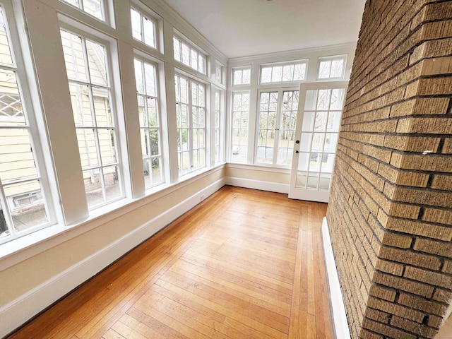 187 W Park Ave, New Haven, CT 06511 - unfurnished sunroom featuring french doors, baseboards, ornamental molding, and wood-type flooring