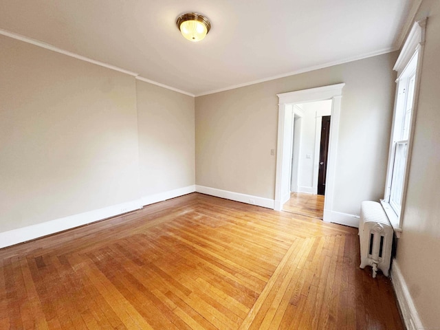 187 W Park Ave, New Haven, CT 06511 - unfurnished room featuring light wood-type flooring, crown molding, radiator heating unit, and baseboards