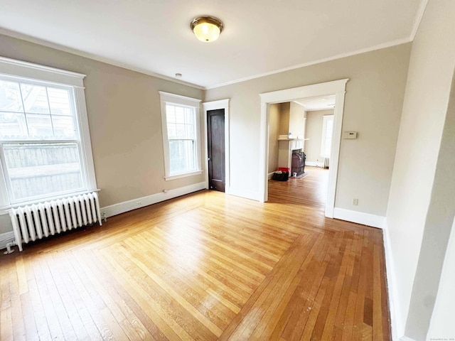 187 W Park Ave, New Haven, CT 06511 - unfurnished room with ornamental molding, light wood finished floors, radiator heating unit, and baseboards