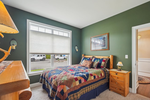 bedroom with baseboards and carpet floors