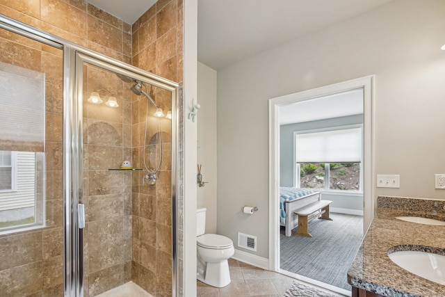 full bathroom with toilet, visible vents, a stall shower, and a sink