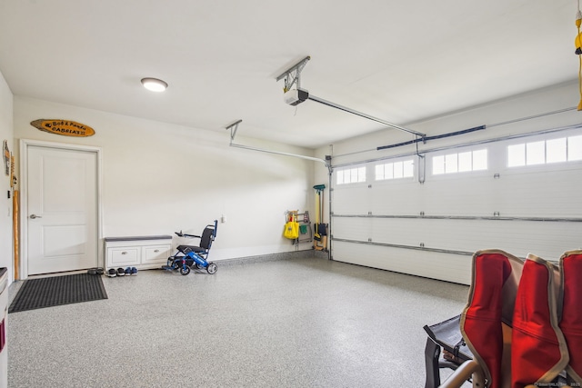 garage featuring baseboards and a garage door opener