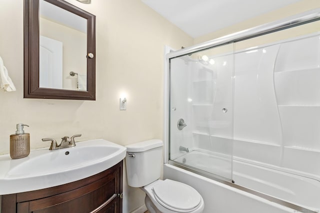full bathroom with toilet, bath / shower combo with glass door, and vanity
