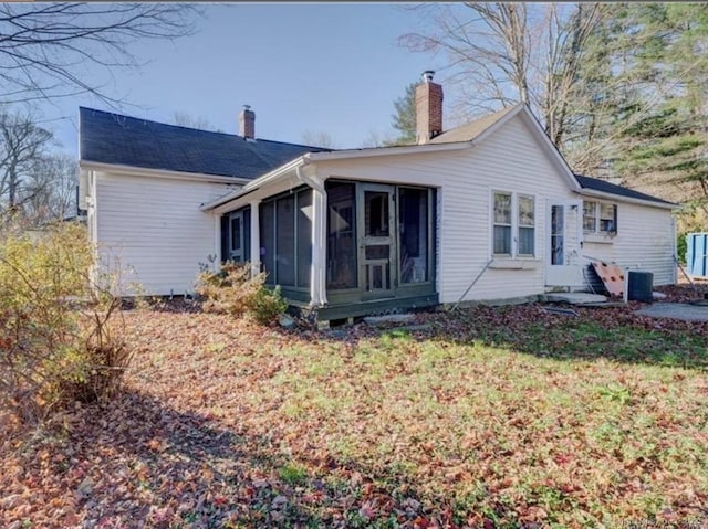 297 Main St, Hampton, CT 06247 - back of house with a chimney, a sunroom, and central air condition unit
