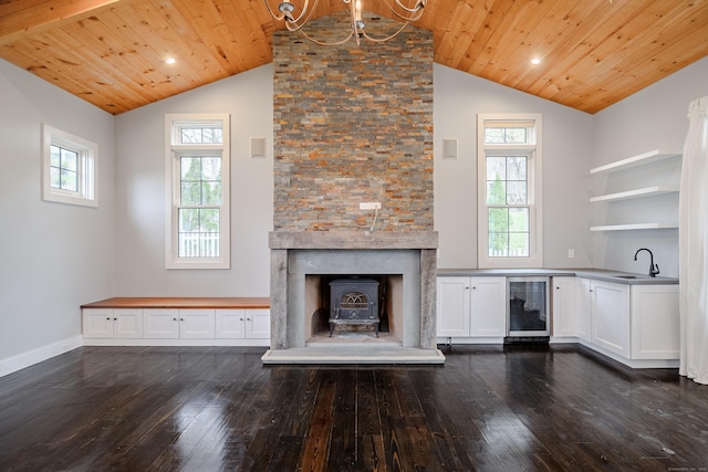 unfurnished living room featuring wine cooler, wood ceiling, dark wood finished floors, and lofted ceiling
