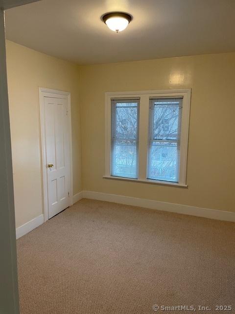 302 High St, Naugatuck, CT 06770 - unfurnished room featuring light colored carpet and baseboards