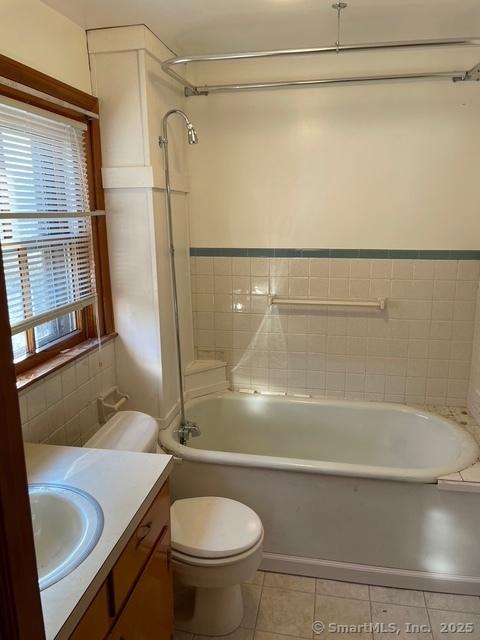 302 High St, Naugatuck, CT 06770 - full bathroom featuring tile patterned flooring, toilet, vanity, and tub / shower combination