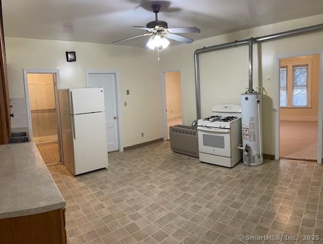 302 High St, Naugatuck, CT 06770 - kitchen featuring a barn door, white appliances, ceiling fan, gas water heater, and baseboards