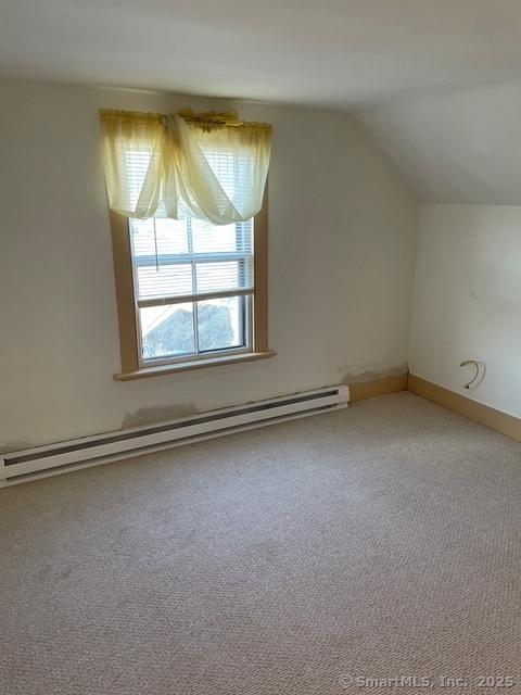 302 High St, Naugatuck, CT 06770 - bonus room featuring a baseboard heating unit, vaulted ceiling, and carpet
