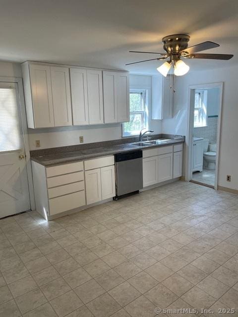 302 High St, Naugatuck, CT 06770 - kitchen featuring white cabinets, a sink, dark countertops, ceiling fan, and dishwasher