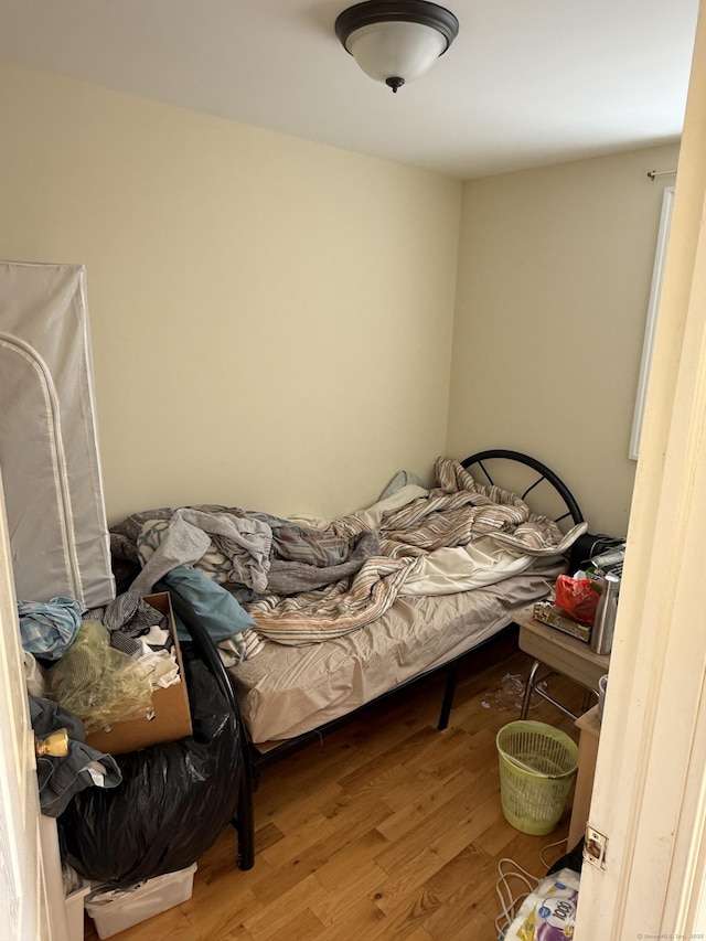 bedroom with wood finished floors
