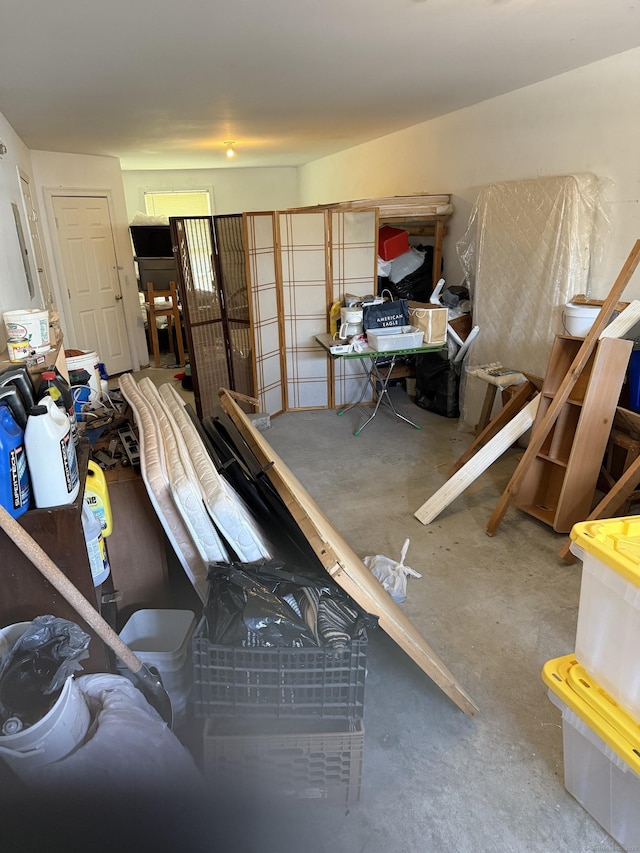 miscellaneous room with unfinished concrete floors