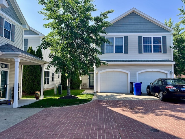 450 Naugatuck Ave Unit 450, Milford, CT 06460 - view of front facade featuring decorative driveway, a garage, and central AC unit