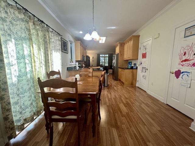 450 Naugatuck Ave Unit 450, Milford, CT 06460 - dining area with a chandelier, crown molding, wood finished floors, and baseboards