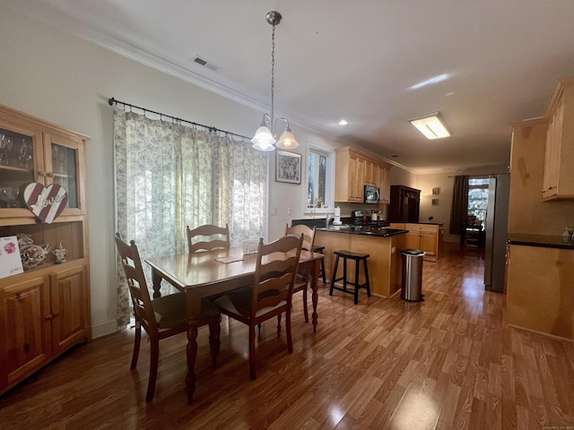 450 Naugatuck Ave Unit 450, Milford, CT 06460 - dining room with wood finished floors, crown molding, and a chandelier
