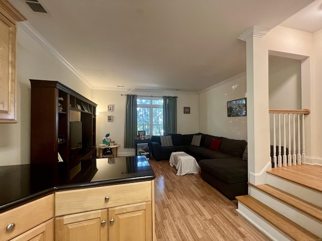 450 Naugatuck Ave Unit 450, Milford, CT 06460 - kitchen with light wood-style floors, dark countertops, light brown cabinetry, open floor plan, and crown molding