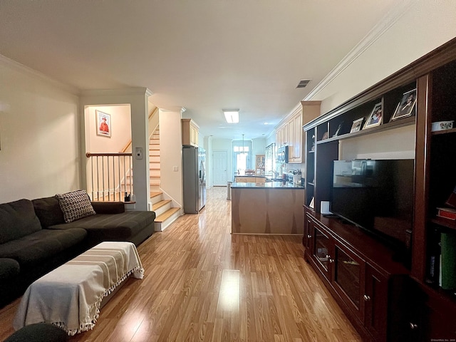 450 Naugatuck Ave Unit 450, Milford, CT 06460 - living area with stairs, light wood-style flooring, and crown molding