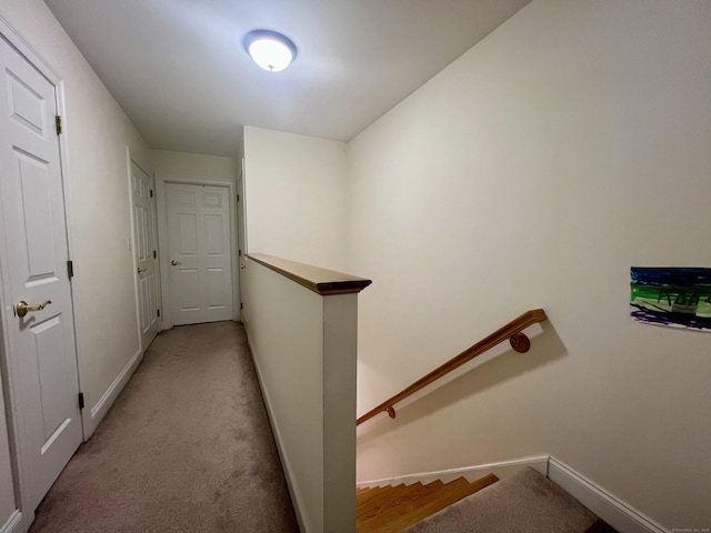 450 Naugatuck Ave Unit 450, Milford, CT 06460 - hallway featuring an upstairs landing, baseboards, and light colored carpet