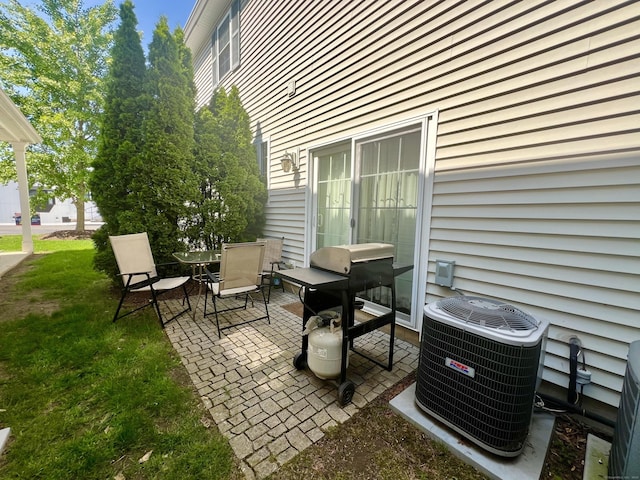 450 Naugatuck Ave Unit 450, Milford, CT 06460 - view of patio / terrace with central AC and outdoor dining area