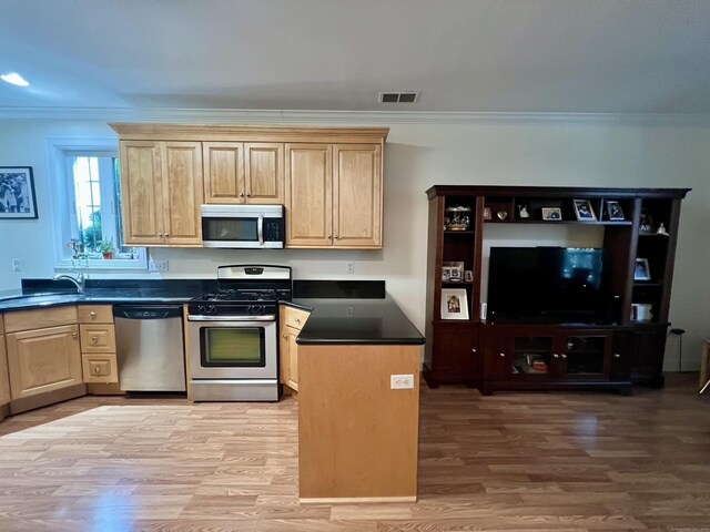 450 Naugatuck Ave Unit 450, Milford, CT 06460 - kitchen with appliances with stainless steel finishes, a sink, ornamental molding, and light brown cabinetry
