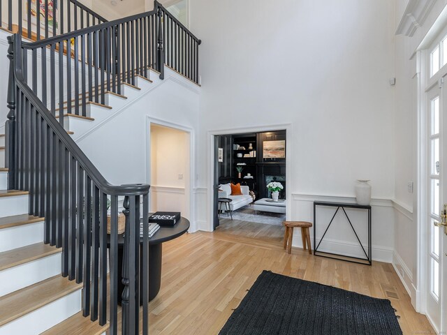 293 Lake Rd, Warren, CT 06777 - foyer entrance with a high ceiling, stairs, and wood finished floors