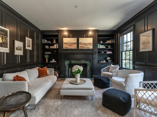 293 Lake Rd, Warren, CT 06777 - living area featuring built in features, a fireplace, and crown molding