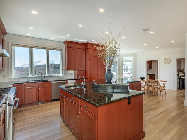 293 Lake Rd, Warren, CT 06777 - kitchen featuring stainless steel appliances, a sink, a kitchen island with sink, recessed lighting, and backsplash