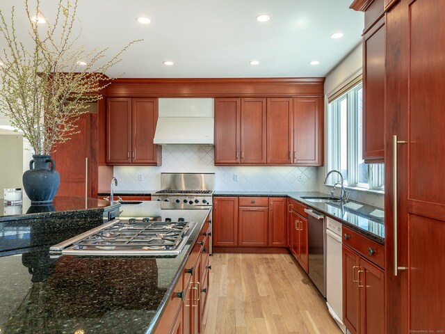 293 Lake Rd, Warren, CT 06777 - kitchen featuring custom range hood, a sink, light wood-type flooring, appliances with stainless steel finishes, and dark stone counters
