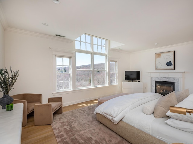 293 Lake Rd, Warren, CT 06777 - bedroom featuring ornamental molding, wood finished floors, a fireplace, and baseboards
