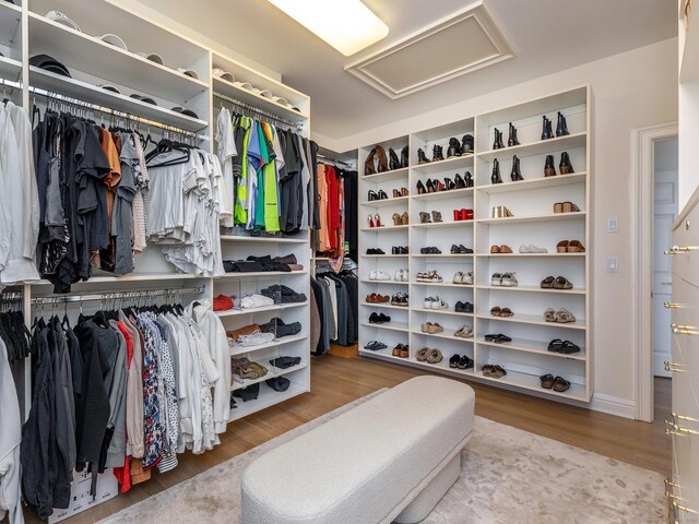 293 Lake Rd, Warren, CT 06777 - walk in closet featuring attic access and wood finished floors