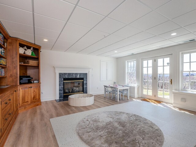 293 Lake Rd, Warren, CT 06777 - living room featuring a drop ceiling, a fireplace, wood finished floors, baseboards, and recessed lighting