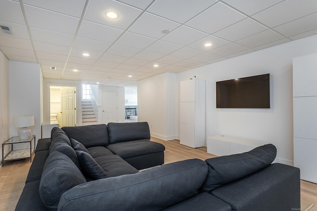 293 Lake Rd, Warren, CT 06777 - living area featuring stairway, light wood finished floors, recessed lighting, baseboards, and a paneled ceiling