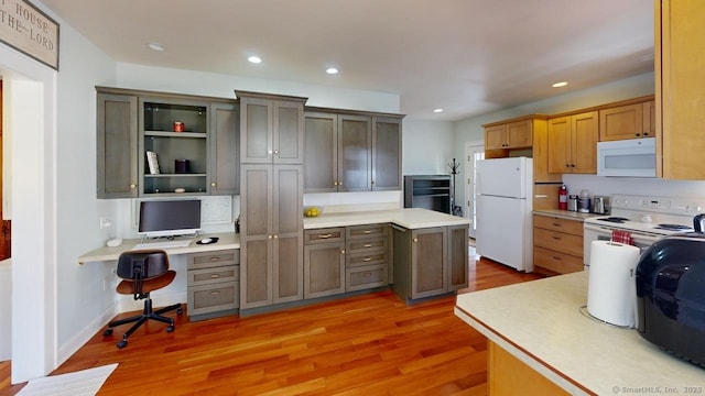 335 Paradise Ave, Hamden, CT 06514 - kitchen featuring light countertops, white appliances, light wood-style floors, and built in study area