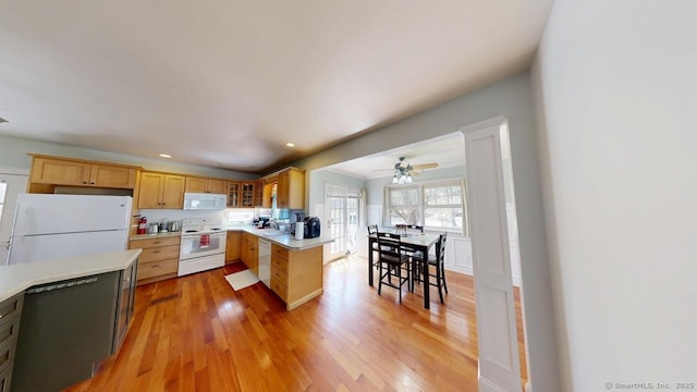 335 Paradise Ave, Hamden, CT 06514 - kitchen with light wood-style flooring, glass insert cabinets, a ceiling fan, white appliances, and light countertops