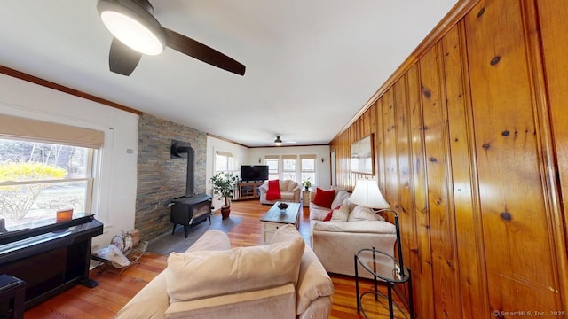 335 Paradise Ave, Hamden, CT 06514 - living room with a wood stove, wood finished floors, ceiling fan, and crown molding