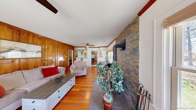 335 Paradise Ave, Hamden, CT 06514 - living room with a ceiling fan, a wood stove, and a healthy amount of sunlight