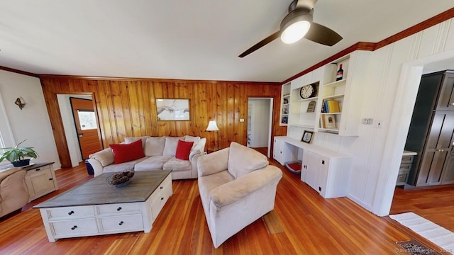 335 Paradise Ave, Hamden, CT 06514 - living room with light wood-style floors, crown molding, wooden walls, and ceiling fan