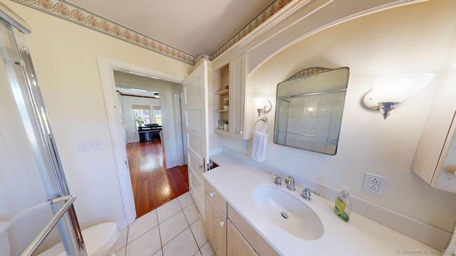 335 Paradise Ave, Hamden, CT 06514 - bathroom with a shower, toilet, tile patterned floors, vanity, and built in features