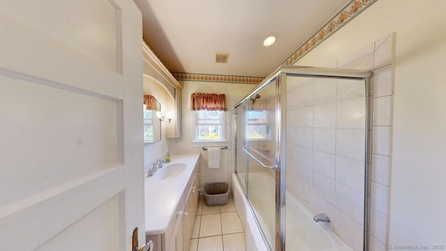 335 Paradise Ave, Hamden, CT 06514 - bathroom featuring combined bath / shower with glass door, visible vents, tile patterned flooring, and vanity