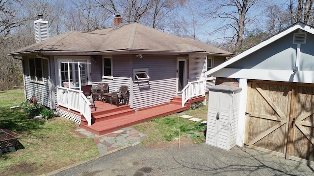 335 Paradise Ave, Hamden, CT 06514 - rear view of house with a chimney and a deck