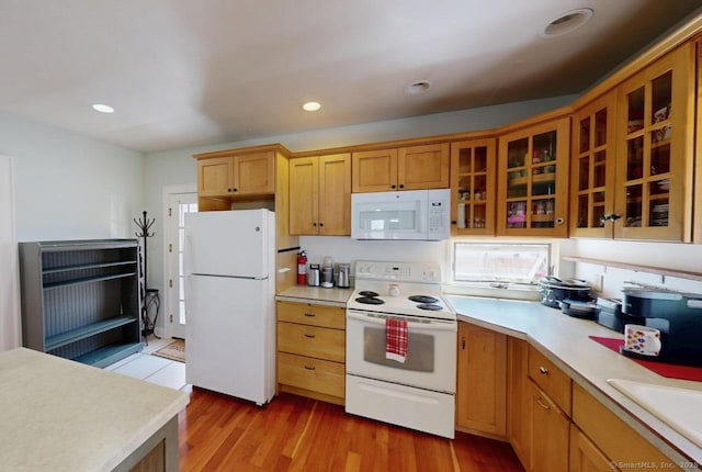 335 Paradise Ave, Hamden, CT 06514 - kitchen with white appliances, glass insert cabinets, light countertops, and a sink
