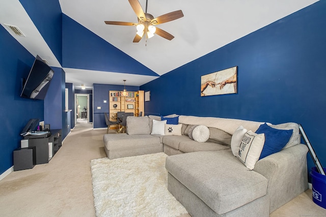 carpeted living area featuring ceiling fan, high vaulted ceiling, baseboards, and a chandelier