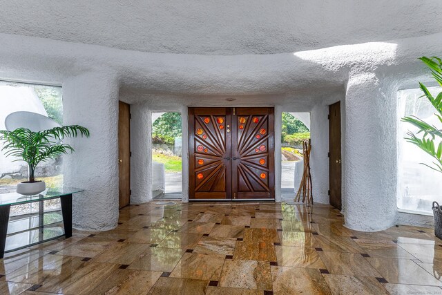 155 Shortwoods Rd, New Fairfield, CT 06812 - foyer entrance with a textured wall, a textured ceiling, and healthy amount of natural light