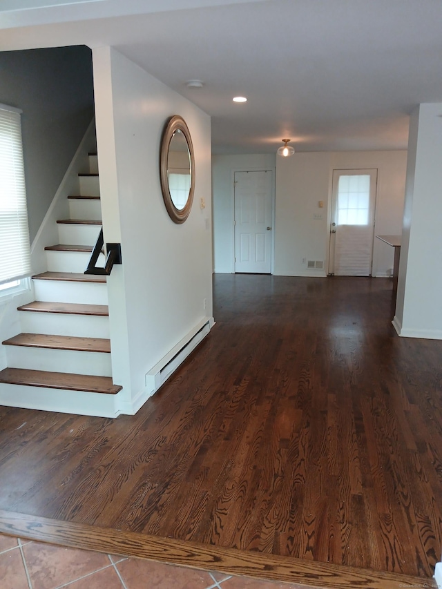 22 Bristol St, Wallingford, CT 06492 - empty room with wood finished floors, stairs, baseboards, baseboard heating, and recessed lighting